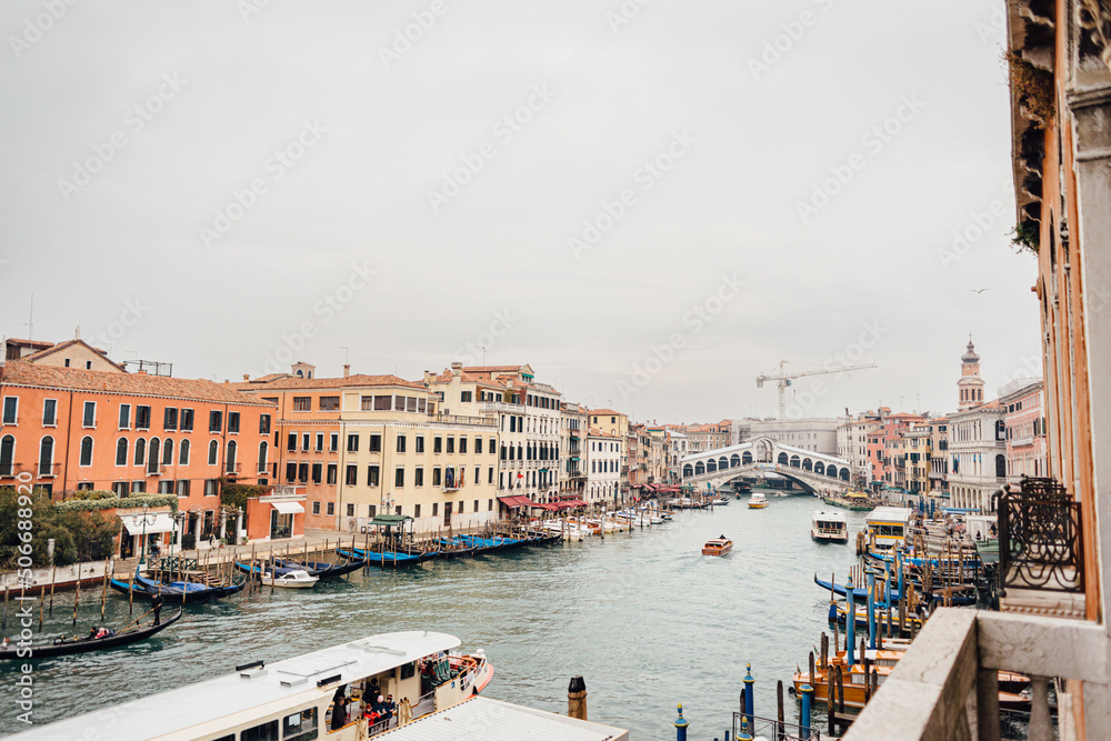 Panoramic view of the famous Venetian Grand Canal and Rialto bridge on a cloudy winter day