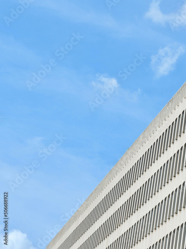 Lined corner of light beige colour building in Madrid, Spain. Abstract architectural backdrop © Yana Demenko