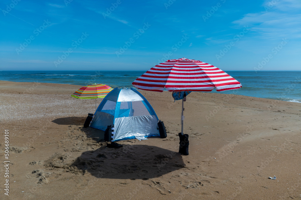 Beach umbrellas and tent on Atlantic coast beach. Sandbridge Virginia Beach, Virginia.