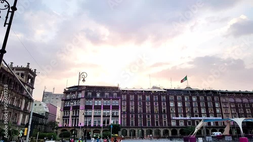 sunset timelapse in the zocalo of mexico city looking towards the hotels photo