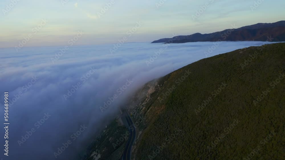 Drone Shots of Pacific Coast Cliffs near Big Sur and Carmel Highlands California during Marine Fog Layer and Sunset. Beautiful 4K Drone footage of Highway 1 Fog. One of 11 in this series. Drone Shots of Pacific Coast Cliffs near Big Sur and Carmel Highlands California during Marine Fog Layer and Sunset. Beautiful 4K Drone footage of Highway 1 Fog. One of 11 in this series.