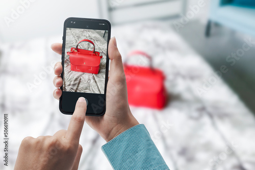 Fotografi Woman taking a picture of her bag