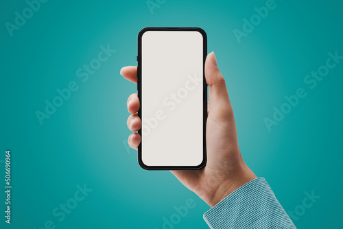 Woman showing a smartphone with blank screen