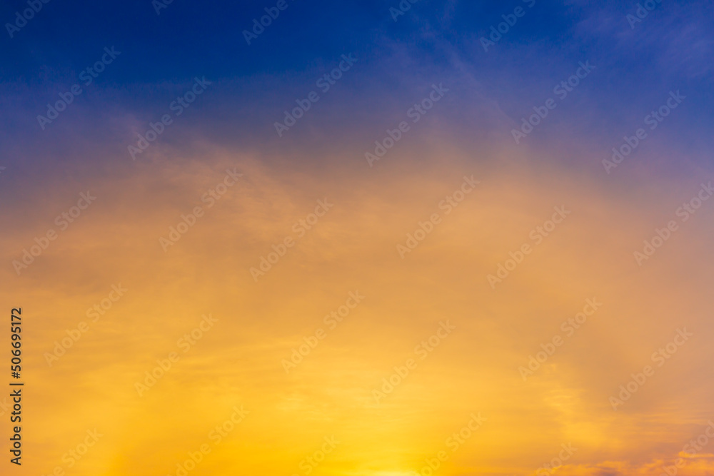 orange sky and clouds background,Background of colorful sky concept, amazing sunset with twilight sky and clouds.