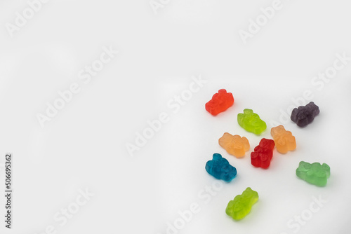 Colorful set of CBD infused medicinal candy gummies used for healing on a plain white background
