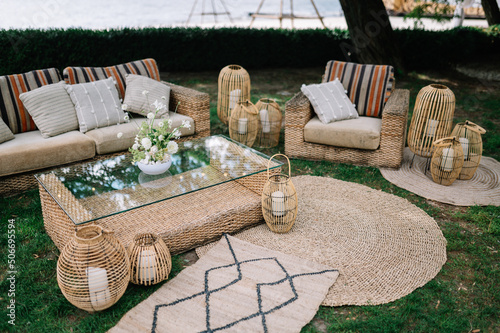 Outdoor Wedding. lounge zone including chairs and tables in boho style
 photo