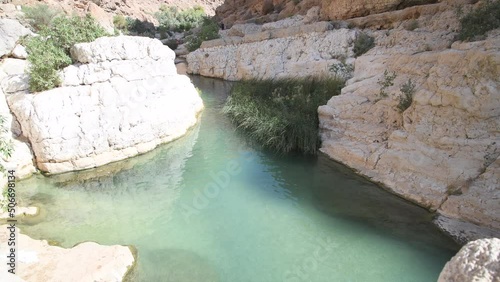 One of the famous natural pool in the canyon of Wadi As Shab, near Wadi Tiwi, a must do activity and idyllic tourist destination. Sultanate of Oman, Middle East, Arabian Peninsula
