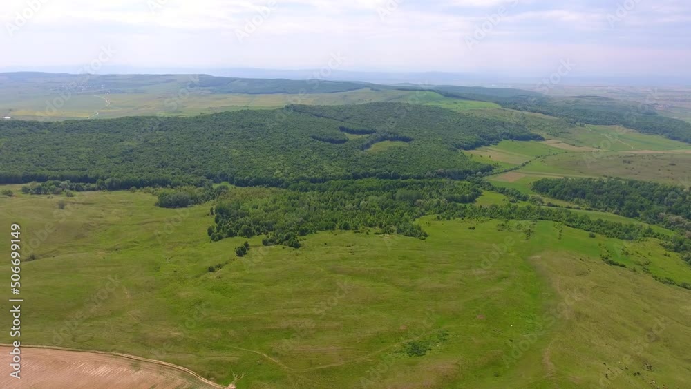 Aerial view of harvest fields and forest, Spring time, beautiful landscape of Romania Aerial view of harvest fields and forest, Spring time, beautiful landscape of Romania