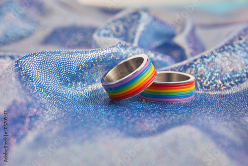 Rainbow rings for LGBT wedding on shining fabric background. LGBTQ22VL photo