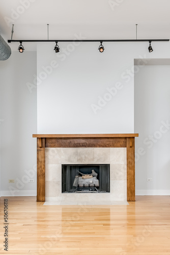 Vertical Fireplace Close Up with Empty Wall Above Mantle. Vacant living room for virtual staging. Loft style living room and fireplace.