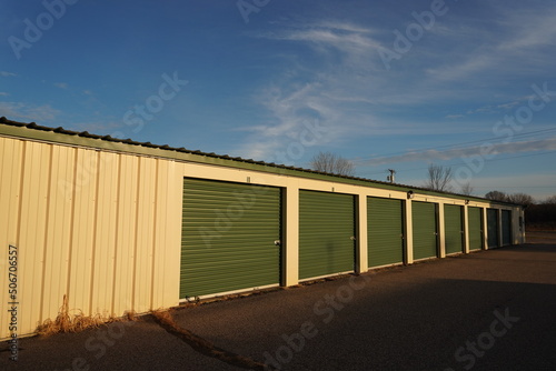 Green and tan storage units service the community to hold the owner's property.