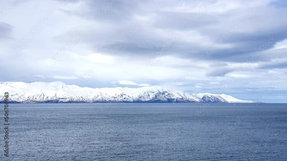 Timelapse view of the beautiful nature in Iceland. Mighty mountains on the horizon with clouds passing over. Timelapse view of the beautiful nature in Iceland. Mighty mountains on the horizon with clouds passing over.