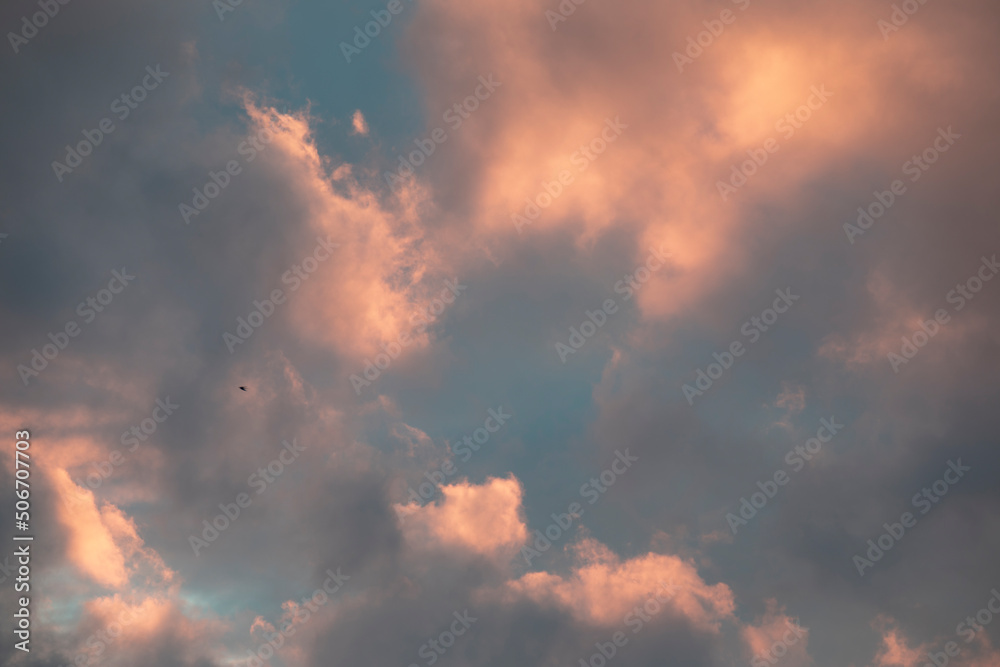 Dark sky background with dramatic thunder clouds and sunlight, sky background Dark sky background with dramatic thunder clouds and sunlight, sky background