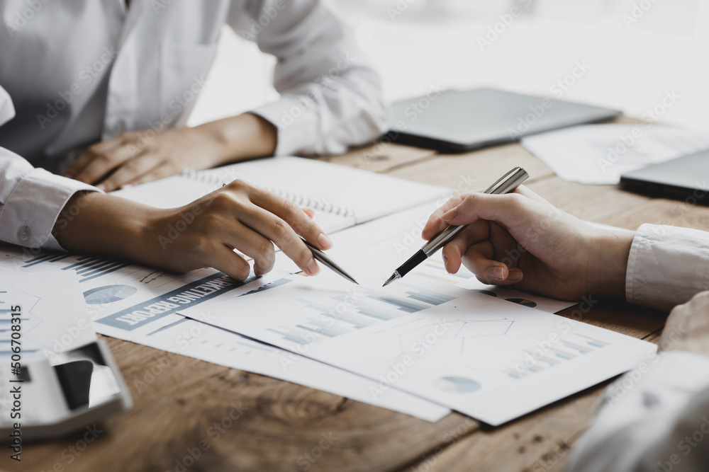 Atmosphere of a meeting room of a company, a meeting of businessmen, founders and partners are meeting to discuss and brainstorm ideas to plan the company to achieve goals and grow.