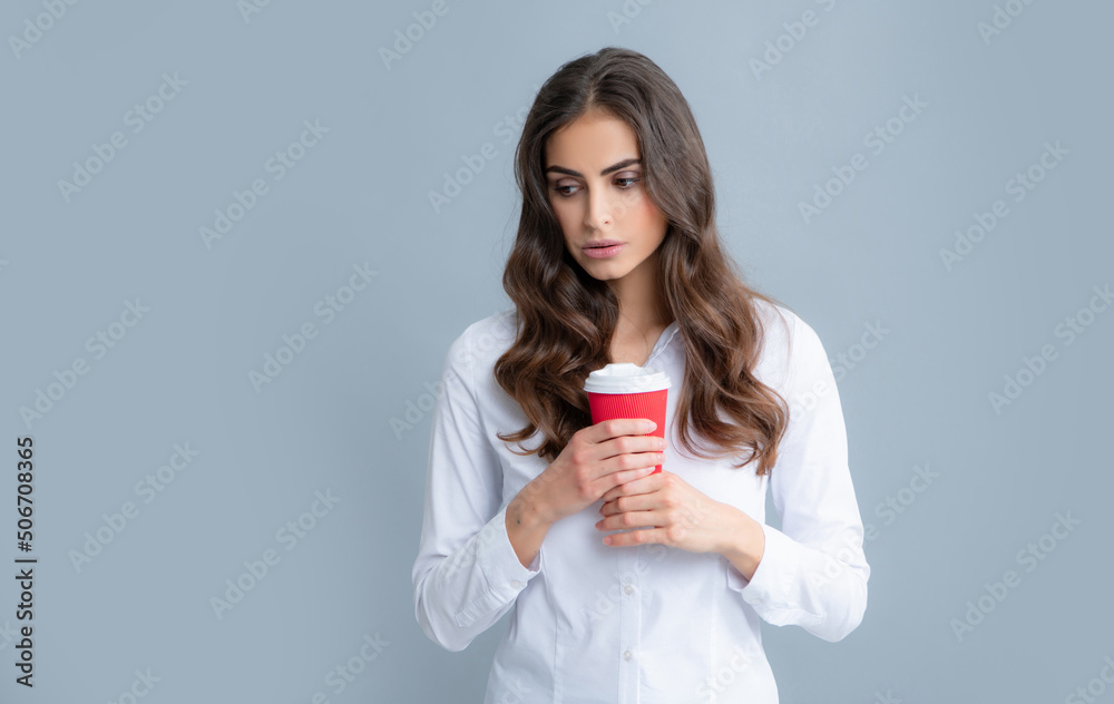 Beautiful young woman enjoying a cup of coffee while relaxing. People, drinks and leisure break, happy young woman with cup of tea or coffee. Beautiful young woman enjoying a cup of coffee while relaxing. People, drinks and leisure break, happy young woman with cup of tea or coffee.