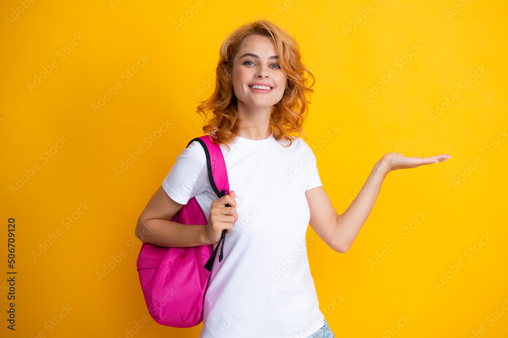 Surprised fun teen student girl with backpack on pastel yellow color background. Education in university college concept. Surprised fun teen student girl with backpack on pastel yellow color background. Education in university college concept.