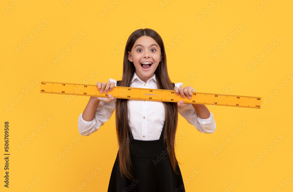 amazed kid in school uniform hold mathematics ruler for measuring, education amazed kid in school uniform hold mathematics ruler for measuring, education