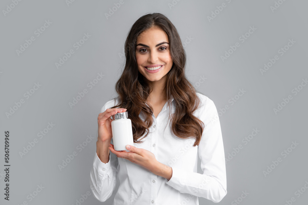 Woman with bottle pills. Happy young African American woman holding bottle of dietary supplements or vitamins in her hands. Healthy lifestyle concept. Woman with bottle pills. Happy young African American woman holding bottle of dietary supplements or vitamins in her hands. Healthy lifestyle concept.