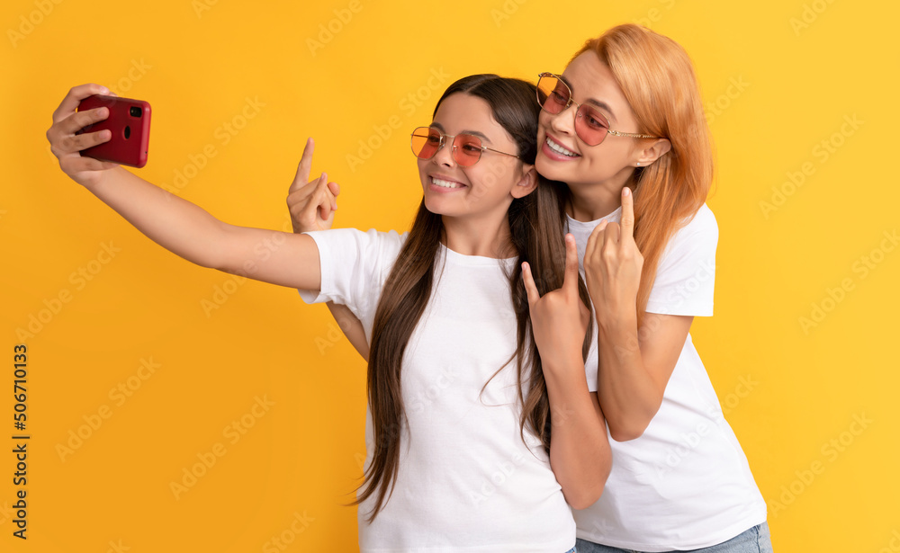 cool happy mother and daughter making selfie on smartphone, friendship cool happy mother and daughter making selfie on smartphone, friendship