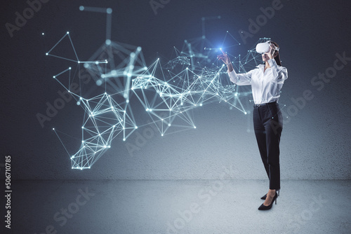 Cyber and digital world technology with woman waring VR headset playing augmented reality or futuristic style games and programs, metaverse concept