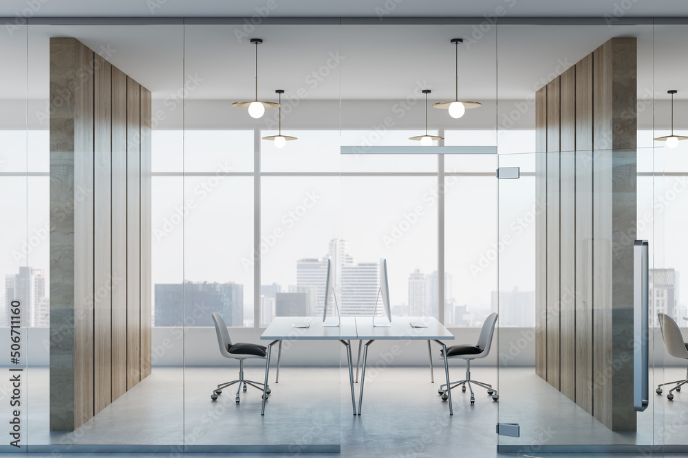 Light stylish office room with glass walls, wooden partitions, modern computers on minimalistic tables and city view from huge window. 3D rendering