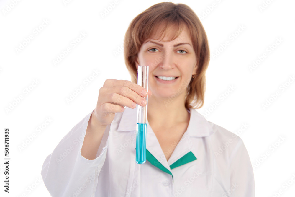 Female scientist examining a chemical reaction in a test tube Female scientist examining a chemical reaction in a test tube