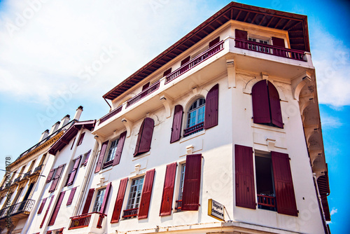 Traditional house in St. Jean de Luz, Basque Country, France. Colorful houses and narrow streets at St. Jean de Luz, France