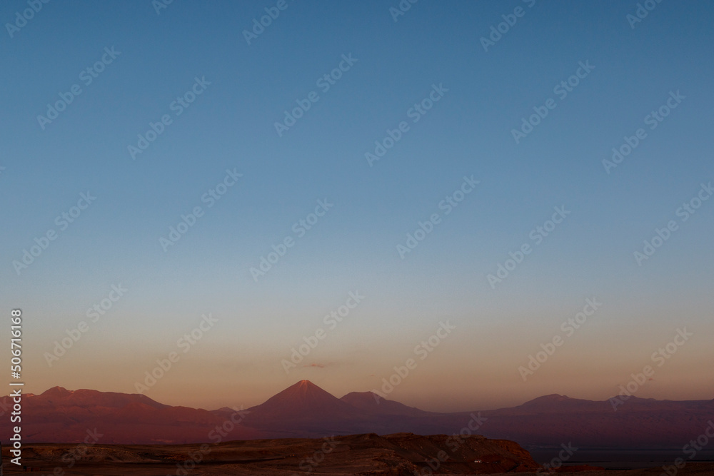 Sunset at the Moon Valley (Valle de la Luna) with the Licancabur volcano, Atacama, Chile, South America