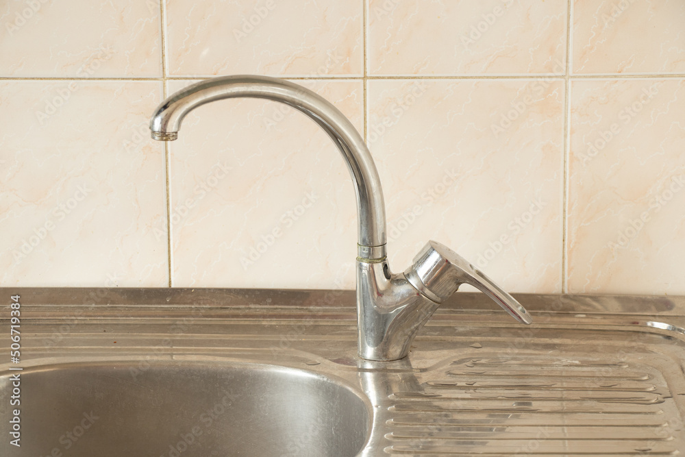Kitchen sink and faucet in the kitchen in the apartment, faucet and faucet Kitchen sink and faucet in the kitchen in the apartment, faucet and faucet
