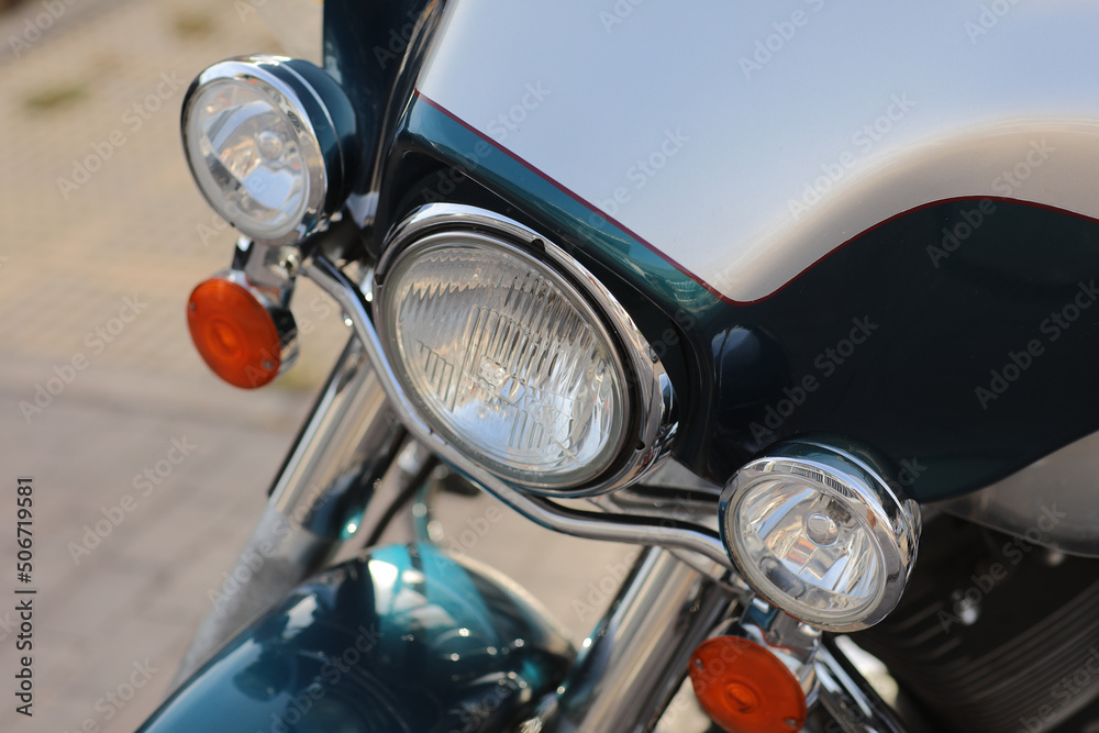 close up of retro headlights. motorcycle parked on the motorcycles parking lot. Meeting of bikers before a join trip through the city street.