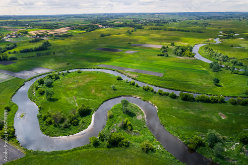 Wild Nida River in Poland Countryside at Spring. Aerial Drone View