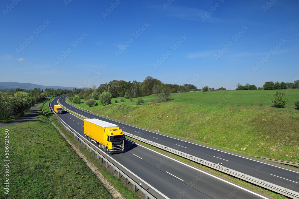 Landscape with a moving truck on the highway.