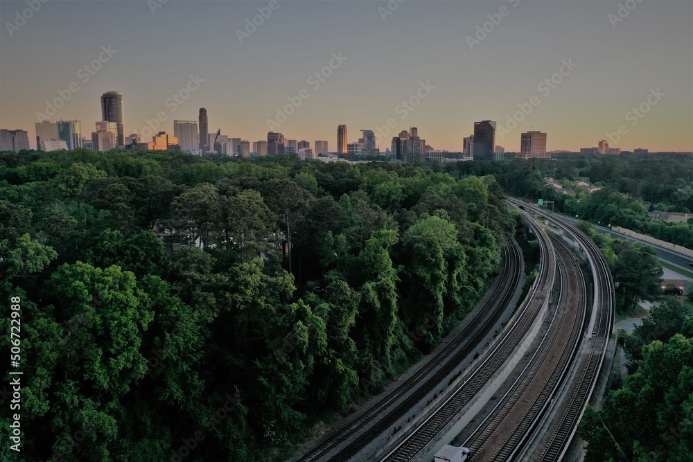 Fototapeta premium railway in the city at sunset