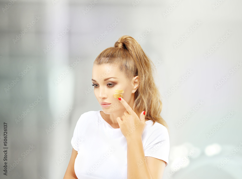 Shot of a beautiful woman.Middle aged woman portrait, cosmetology concept.Applying the cream. Shot of a beautiful woman.Middle aged woman portrait, cosmetology concept.Applying the cream.