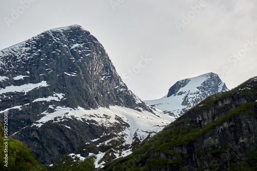 Briksdalsbre glacier. Late afternoon. Fast stream. Glacier waterfall. Spring in Norway. Jostedalsbreen National Park.
