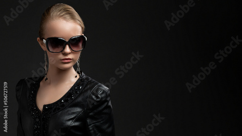 Beautiful young luxury model with big glasses-close up