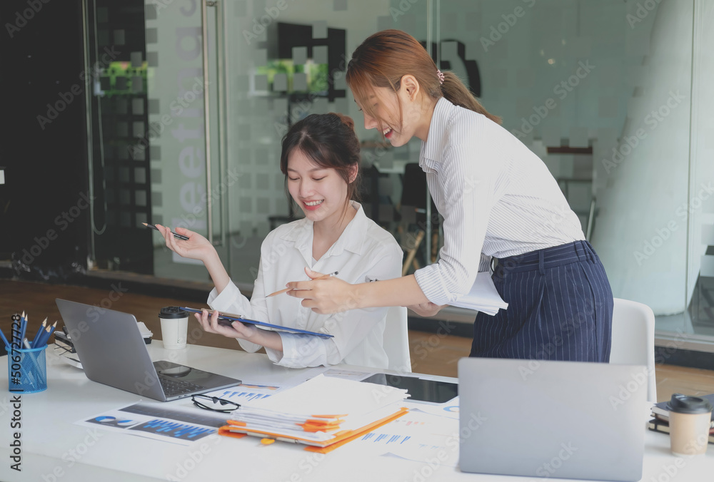 Marketing, Financial, Accounting, Planning, Team of female businessmen and economists use calculators and computers and graph documents to profit the company. Marketing, Financial, Accounting, Planning, Team of female businessmen and economists use calculators and computers and graph documents to profit the company.