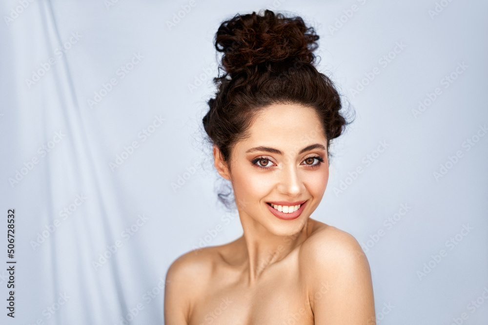 Beauty portrait of young beautiful brunette woman with healthy white smile against grey background. Beauty portrait of young beautiful brunette woman with healthy white smile against grey background.