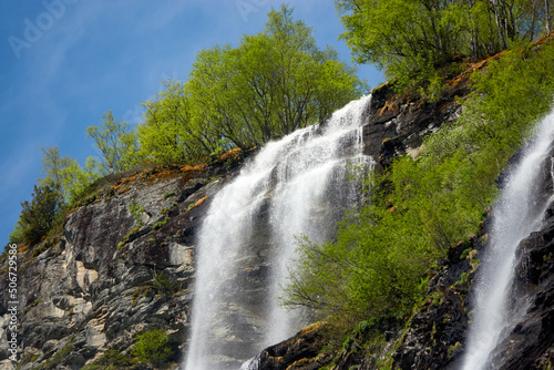 Geirangerfjord. Spring in the norwegian fjords. Reflections. Fishing. Waterfalls. Trees. Boats. Light and clouds. 