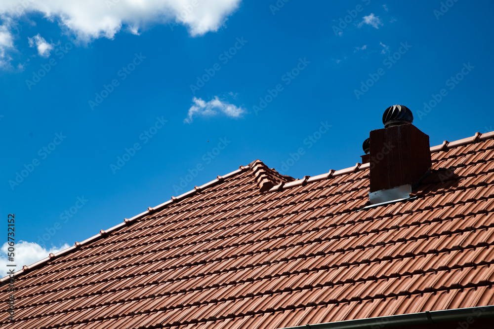 new red tiles roof and blue sky new red tiles roof and blue sky