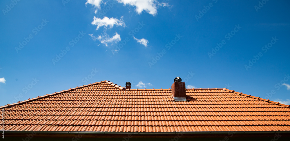 new red tiles roof and blue sky - obrazy, fototapety, plakaty 
