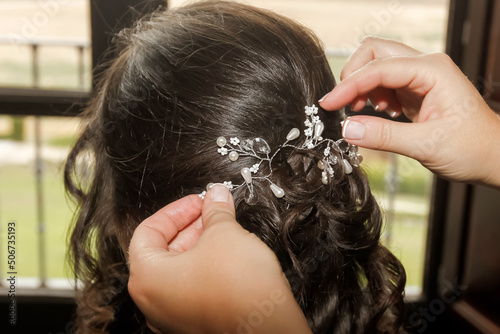 Nice hair ornament that is placed on the head of a woman with dark hair.