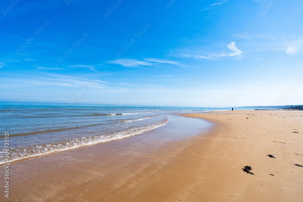Sandy beach with blue sky, seaside
