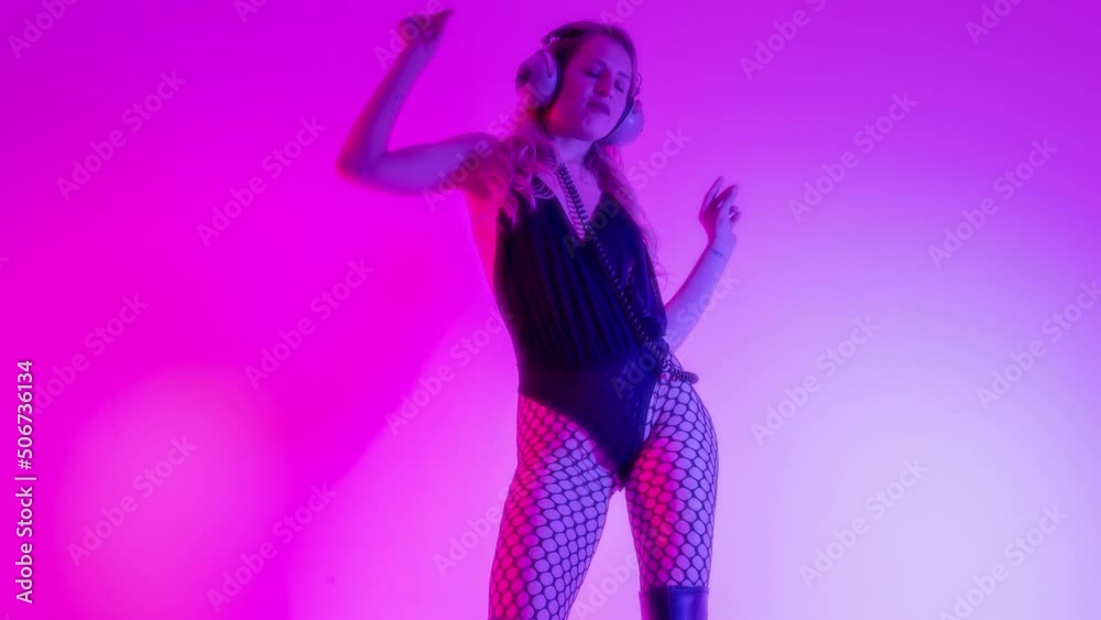 Female dancer posing against colourful background Female dancer posing against colourful background
