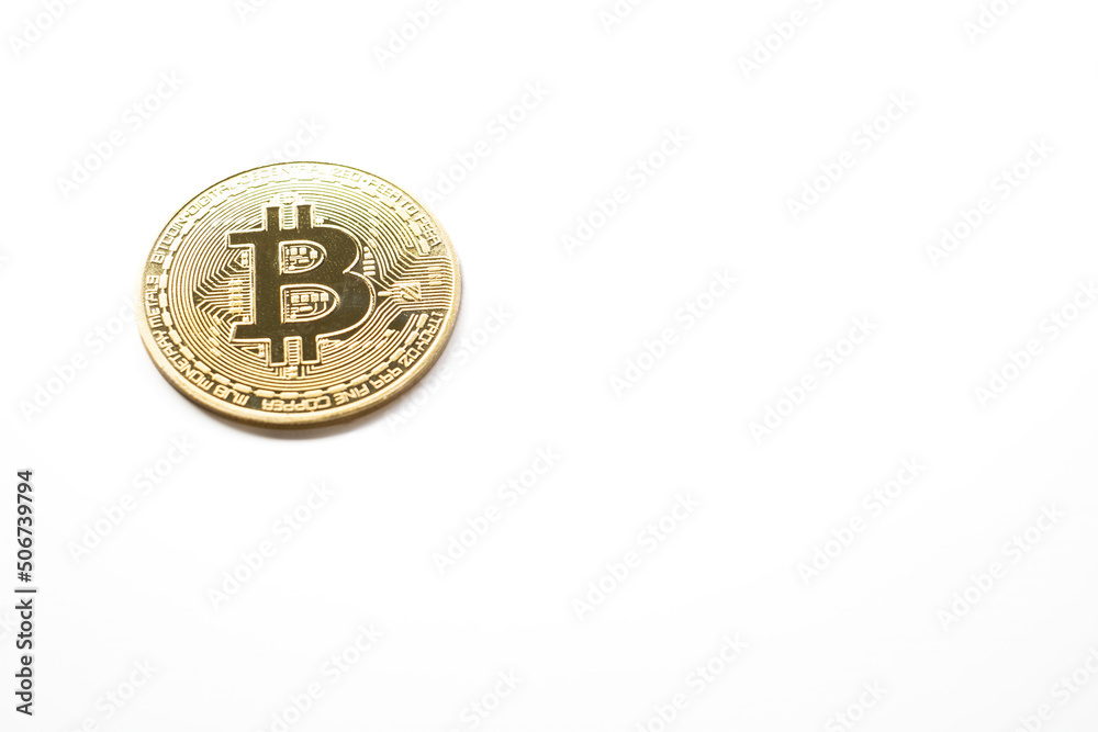 a bit coin on a white background, with copy space, golden cryptocurrency