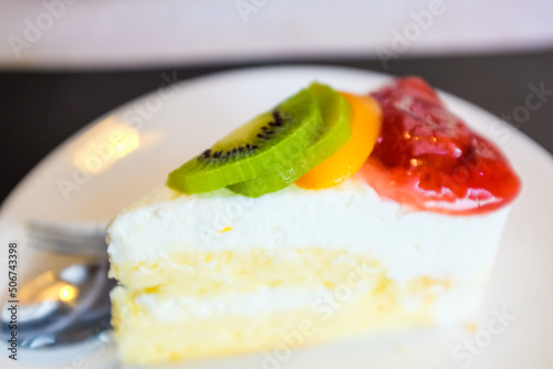 Colourful strawberry kiwi fruit cream cake