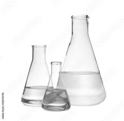 Flasks with transparent liquid on white background