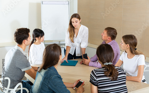 Businesswoman presenting strategy to colleagues in modern office
