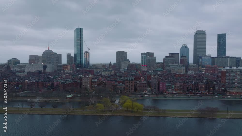 Slide of brick facades of apartment houses in Back bay residential neighbourhood at Charles river. Downtown high rise office towers in background. Boston, USA