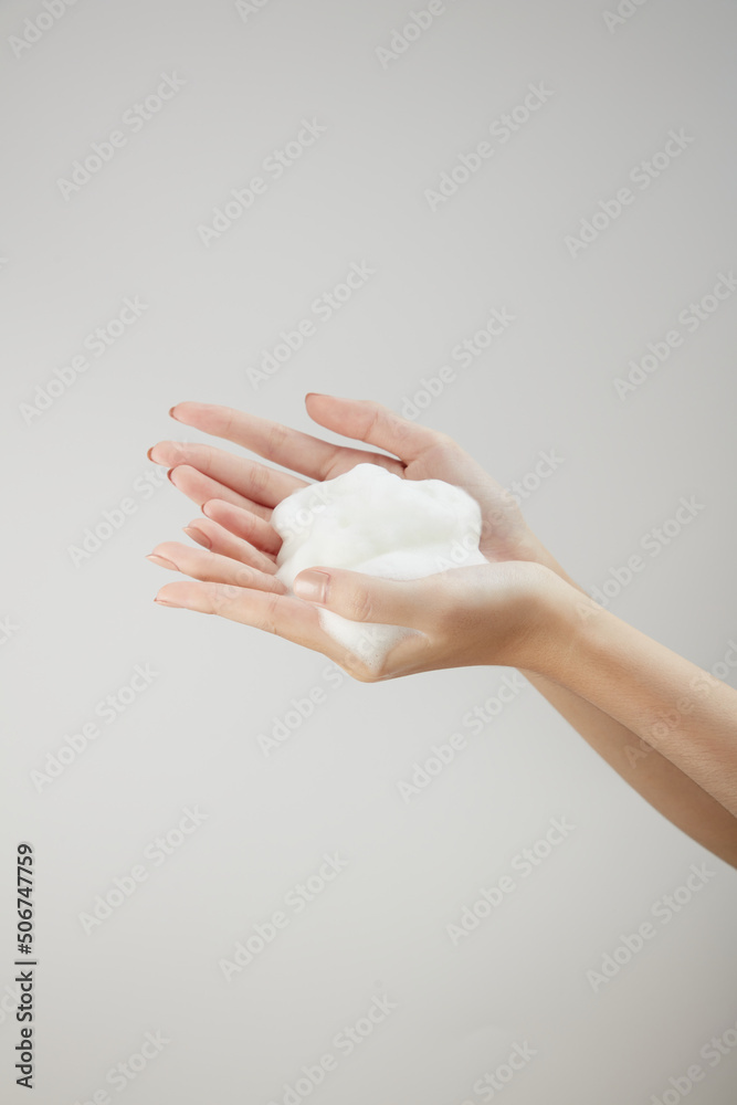 Top view of soap on hand in white background Top view of soap on hand in white background